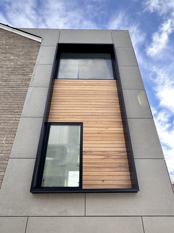 Expansion Art — cedar volume above board-formed concrete