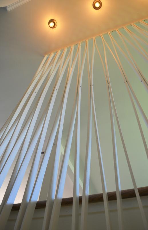 From Safety to Sculpture — poplar ribs fanning from the ceiling