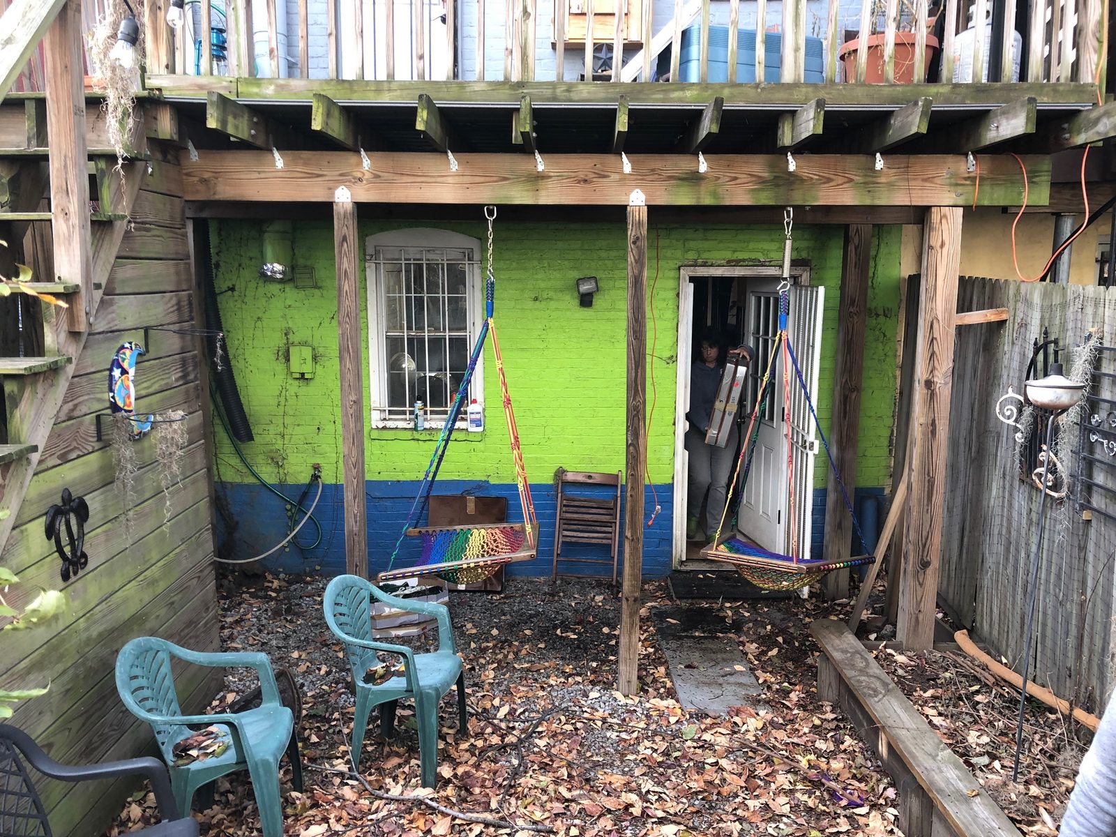 The backyard before, bare gravel and painted brick
