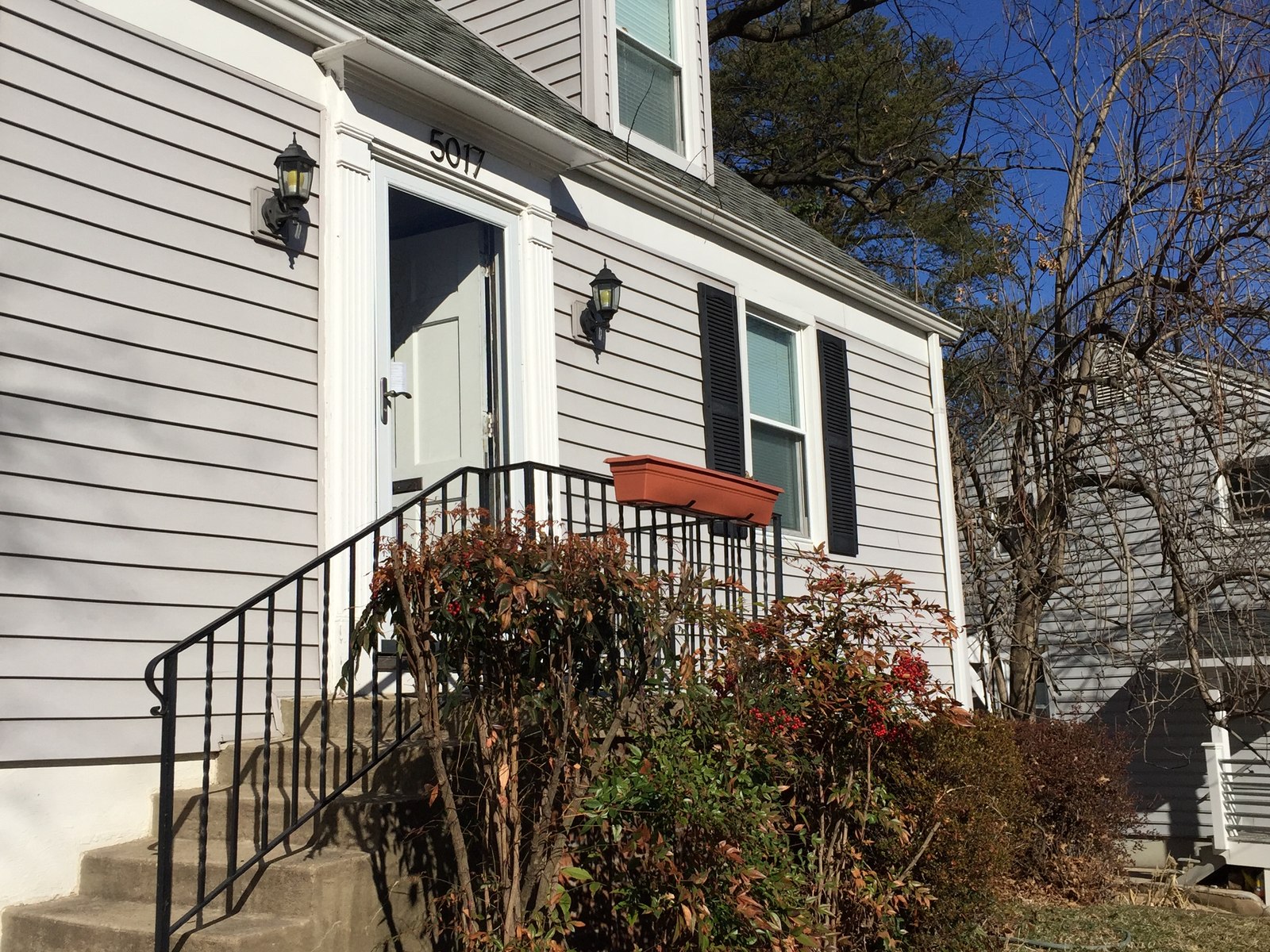 The original front entry before, a single door at grade