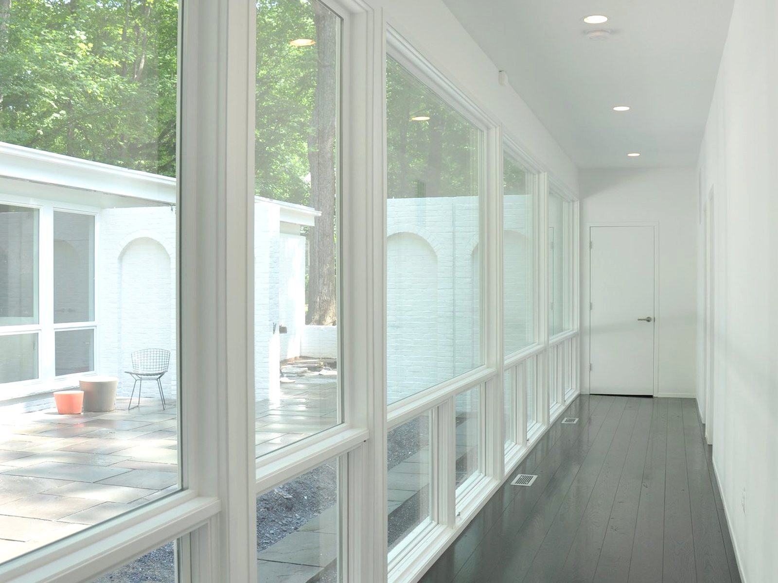 The same run, now glazed the full length and open to the courtyard