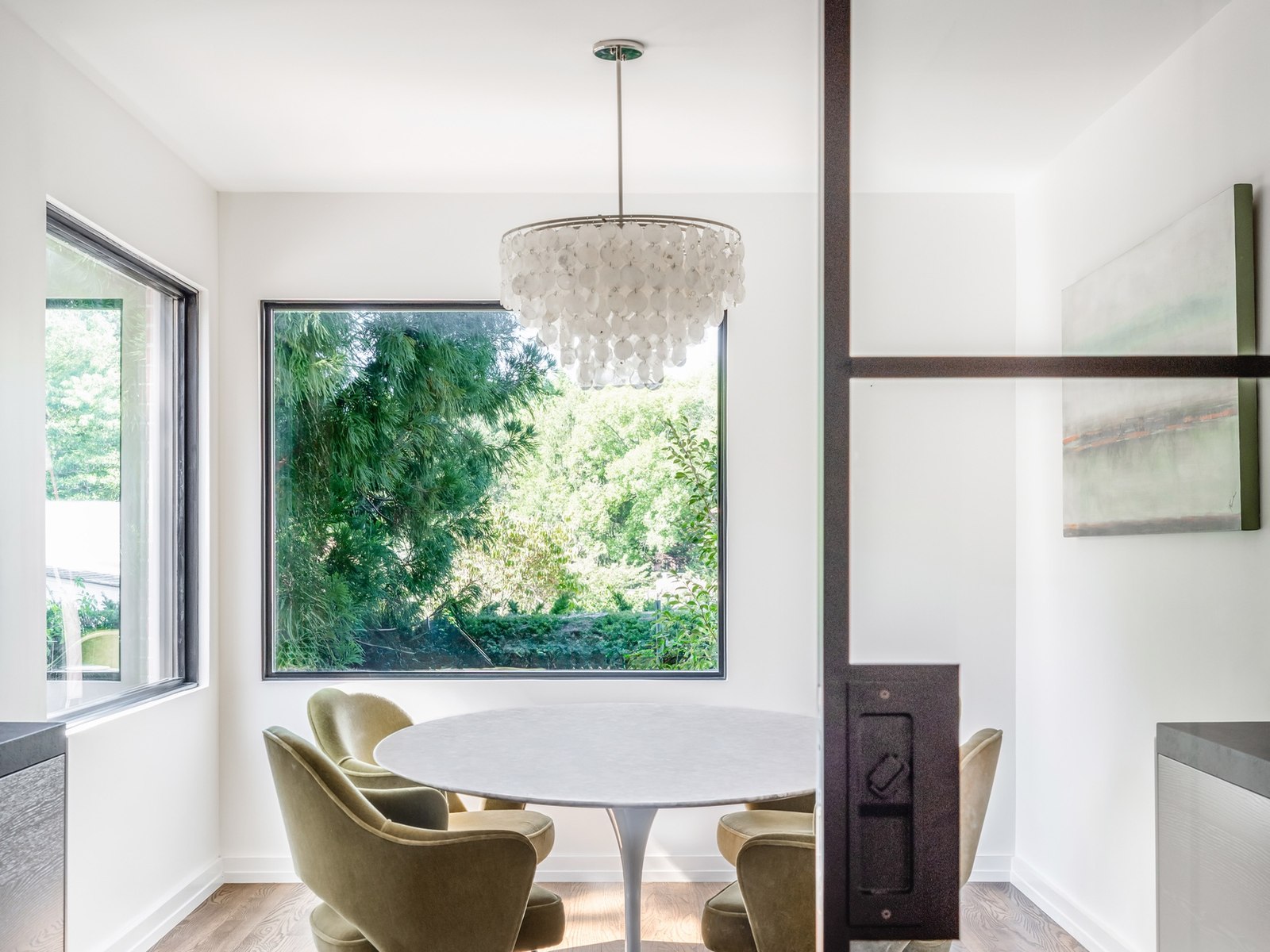 The formal dining room now in that same room, behind steel and glass doors